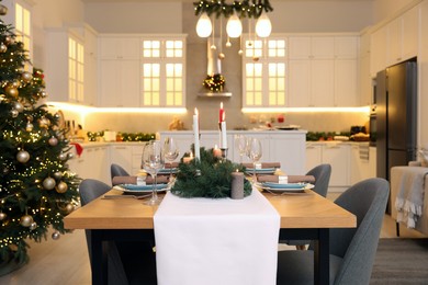 Photo of Cozy spacious kitchen decorated for Christmas. Interior design