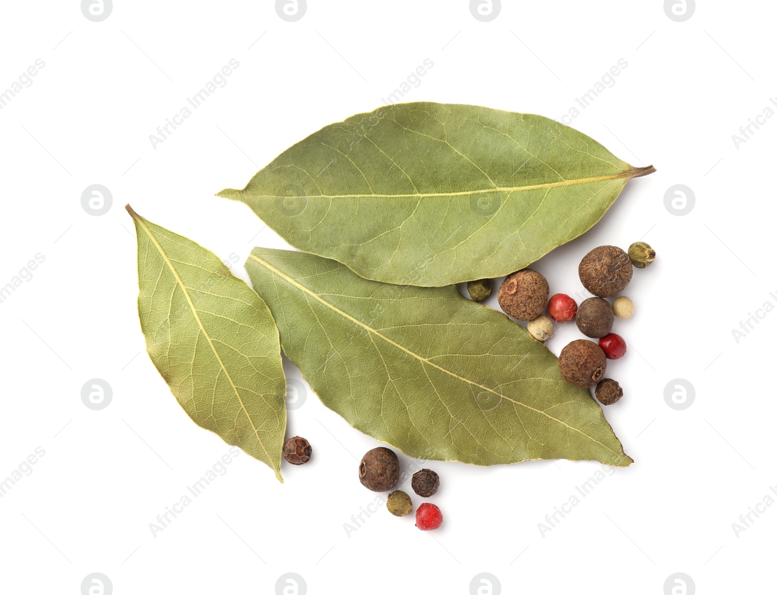 Photo of Aromatic bay leaves and peppercorns on white background, top view