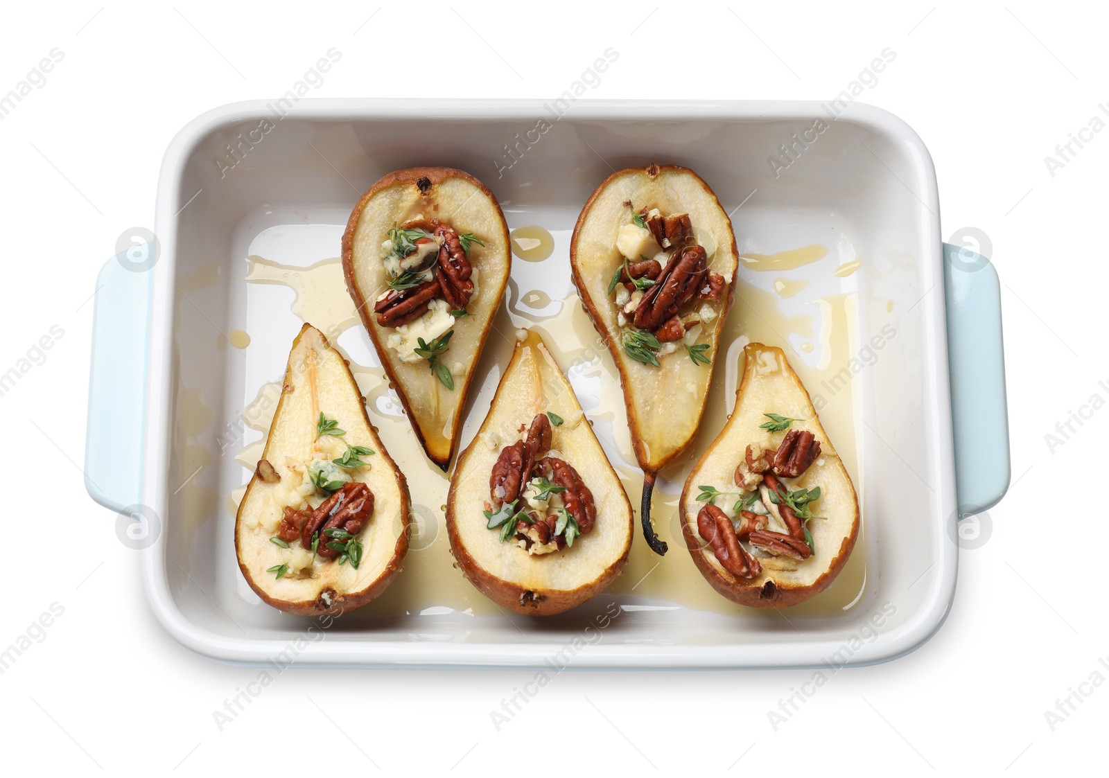 Photo of Tasty baked pears with nuts, blue cheese, thyme and honey in baking dish on white background, top view