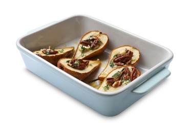 Photo of Tasty baked pears with nuts, blue cheese, thyme and honey in baking dish on white background