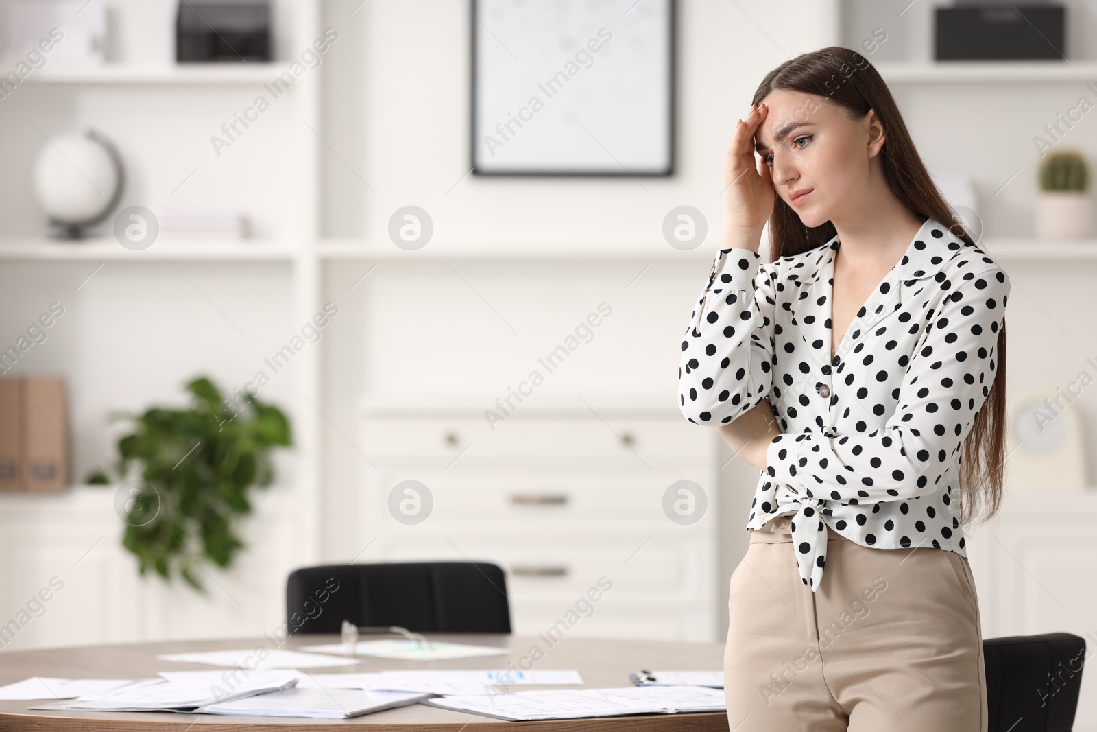 Photo of Embarrassed woman in office, space for text