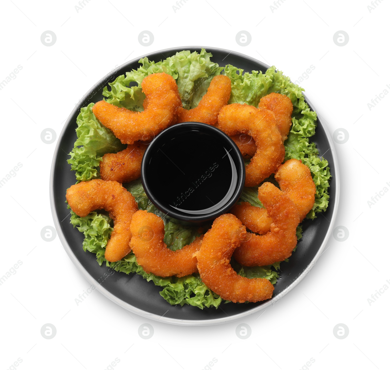 Photo of Delicious breaded fried shrimps, lime and sauce isolated on white, top view