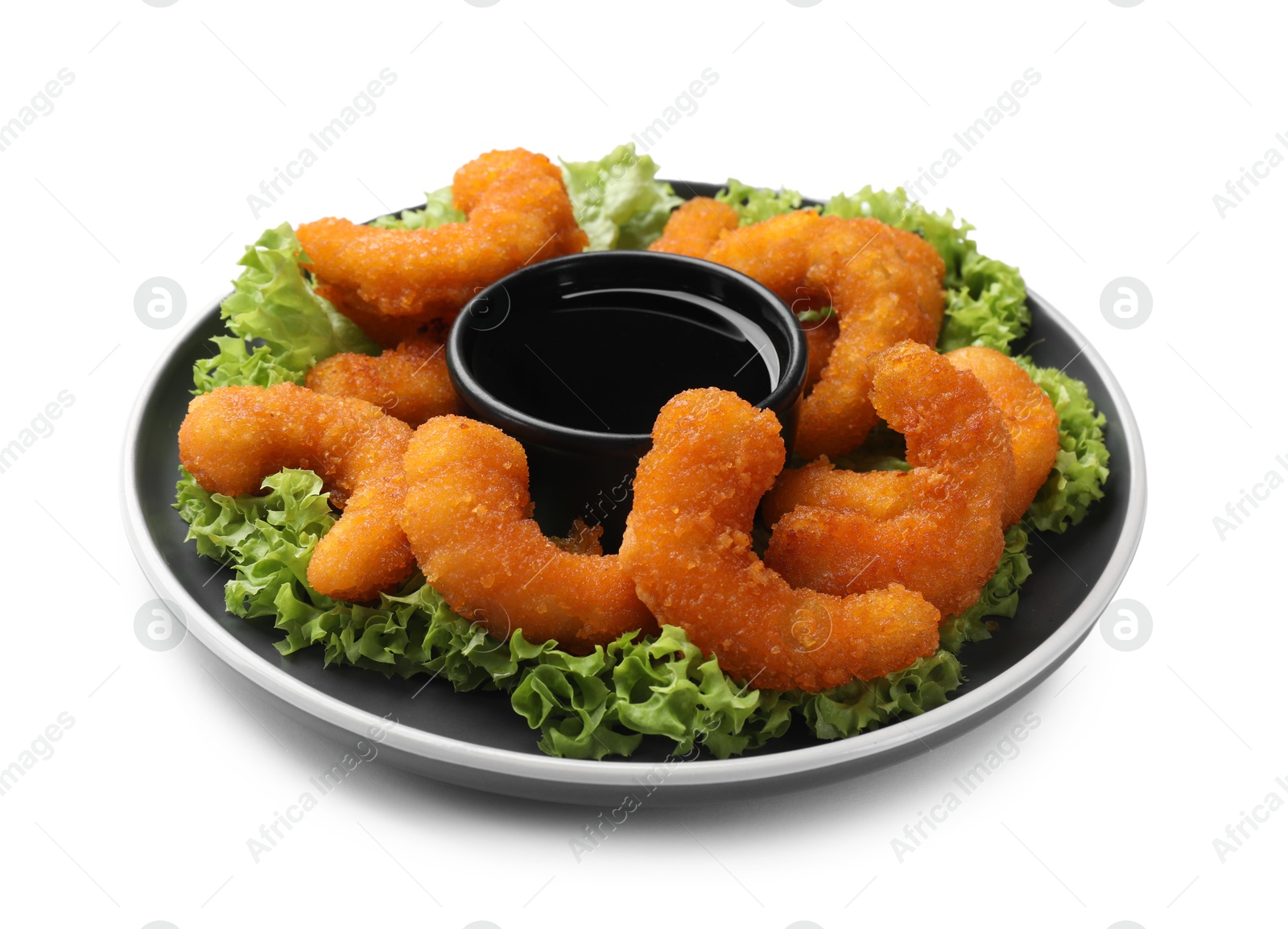 Photo of Delicious breaded fried shrimps, lime and sauce isolated on white