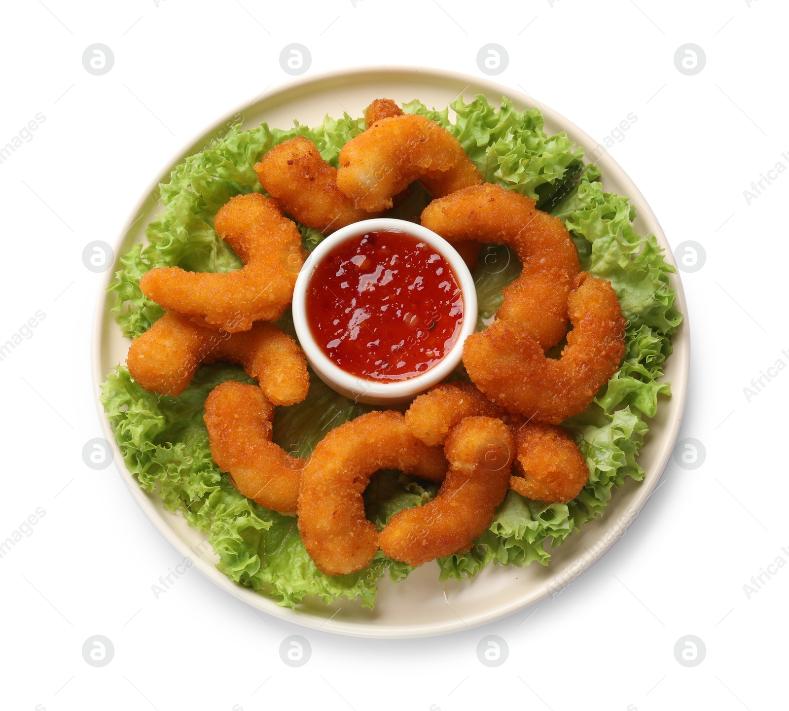 Photo of Delicious breaded fried shrimps, sauce and lettuce isolated on white, top view