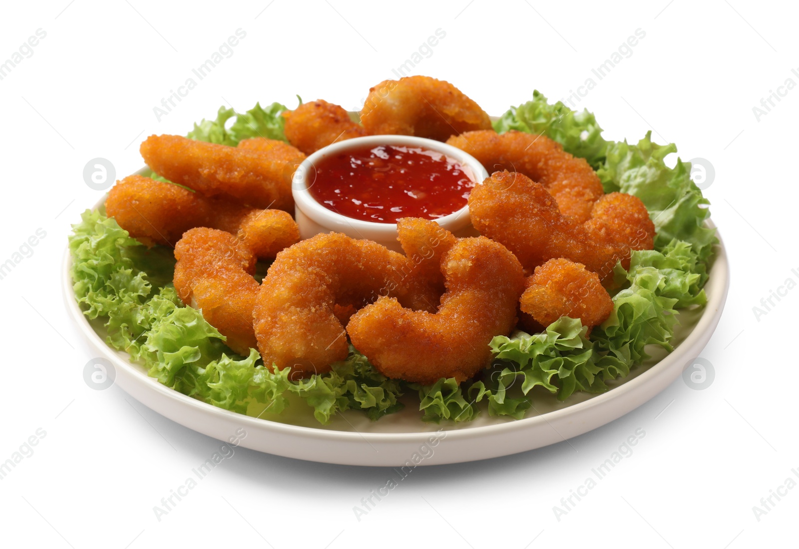 Photo of Delicious breaded fried shrimps, sauce and lettuce isolated on white