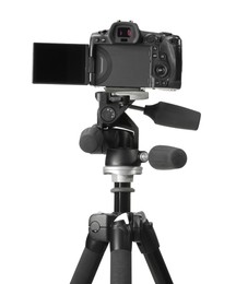 Photo of Modern camera with tripod isolated on white. Photographer's equipment