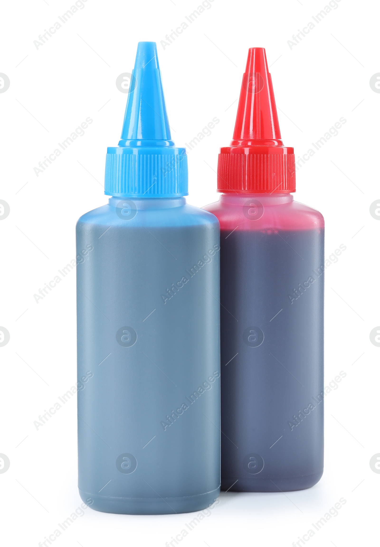 Photo of Bottles of different printer ink isolated on white