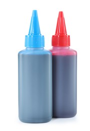 Photo of Bottles of different printer ink isolated on white