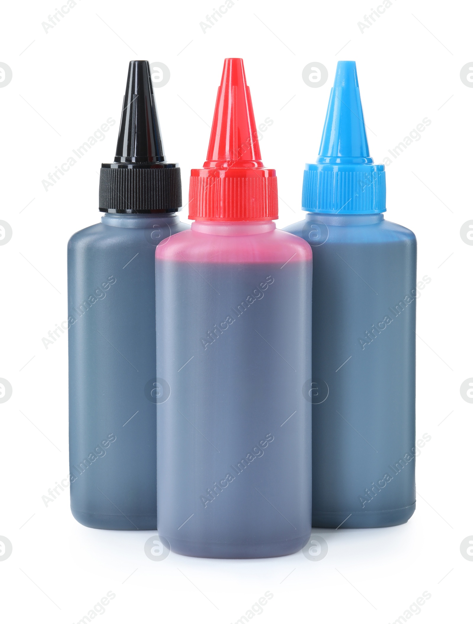 Photo of Bottles of different printer ink isolated on white