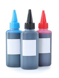 Bottles of different printer ink isolated on white