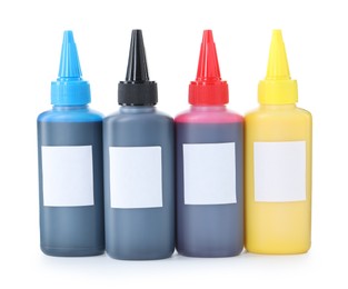 Photo of Bottles of different printer ink isolated on white