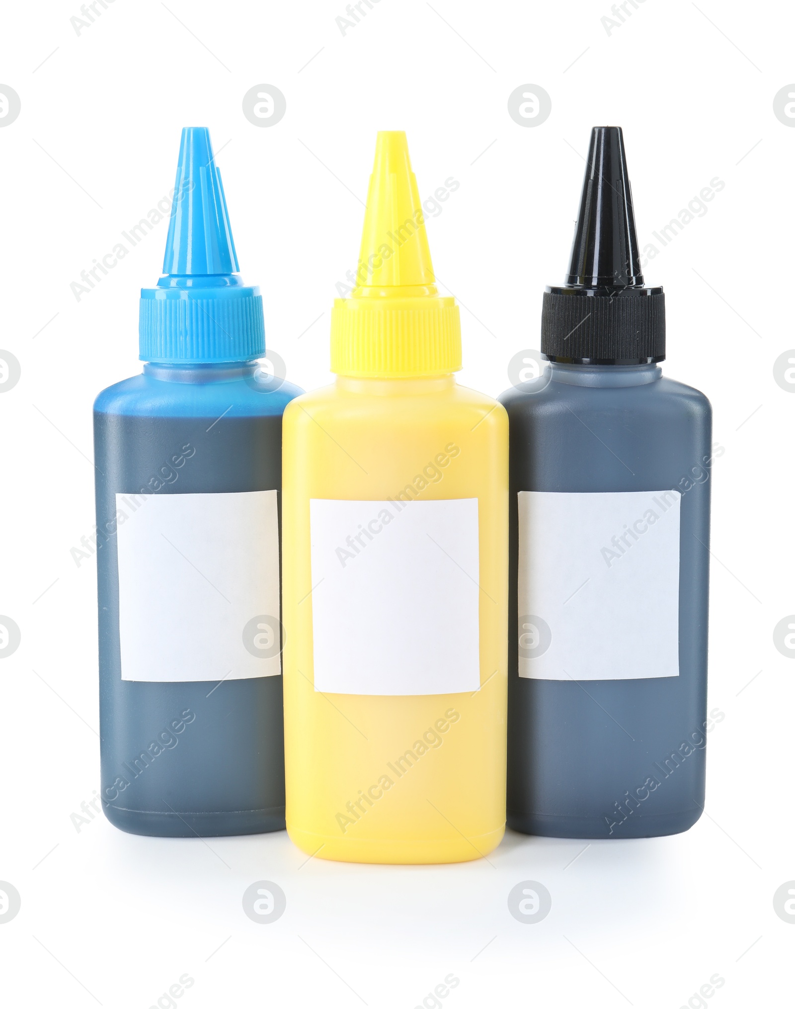 Photo of Bottles of different printer ink isolated on white