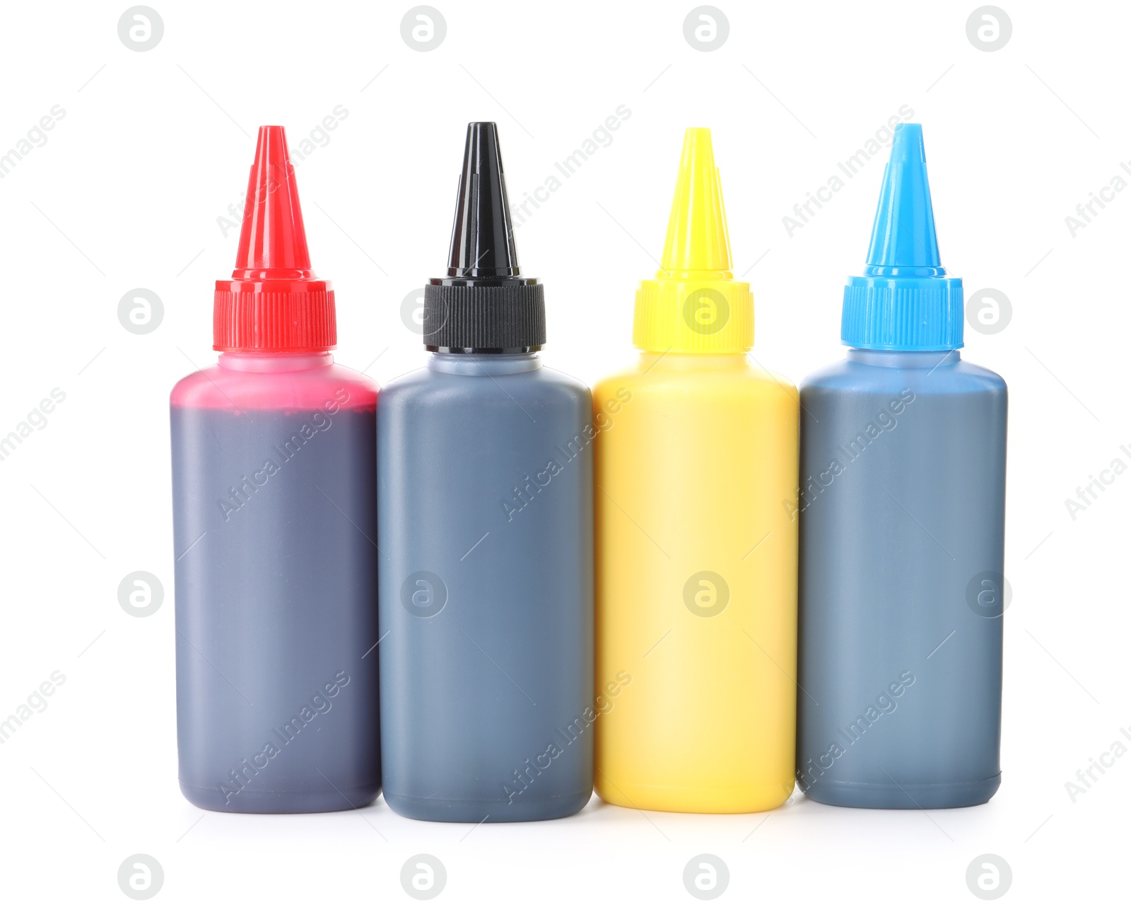 Photo of Bottles of different printer ink isolated on white