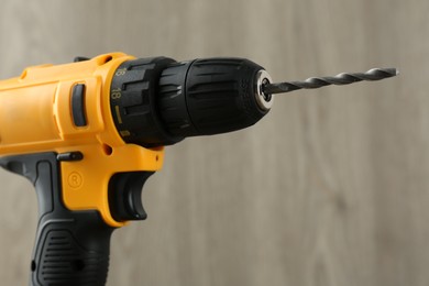 Photo of One cordless electric drill against blurred background