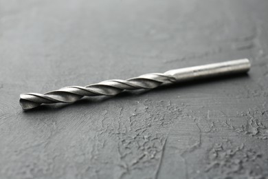 Photo of One new drill bit on grey table