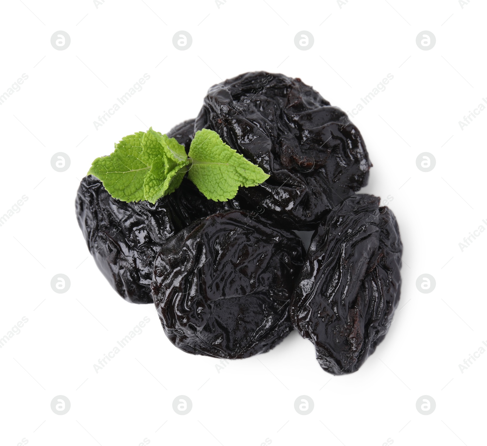 Photo of Tasty dried plums (prunes) and mint leaves isolated on white, top view