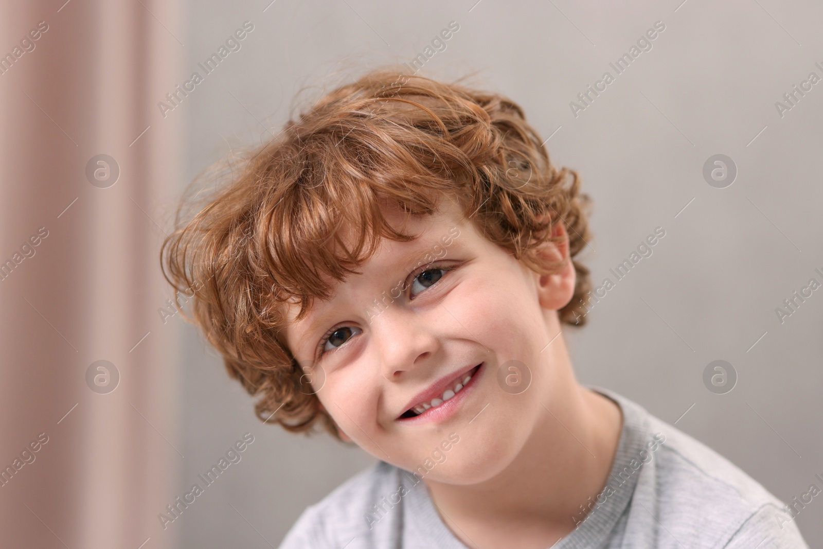 Photo of Portrait of little boy indoors, closeup. Cute child