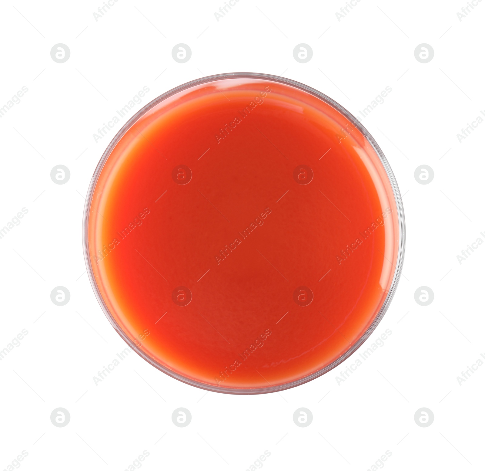 Photo of Fresh tomato juice in glass isolated on white, top view