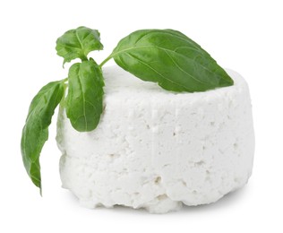 Photo of Fresh ricotta (cream cheese) and basil isolated on white