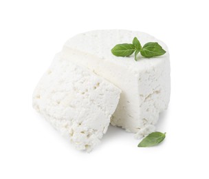 Fresh ricotta (cream cheese) and basil isolated on white