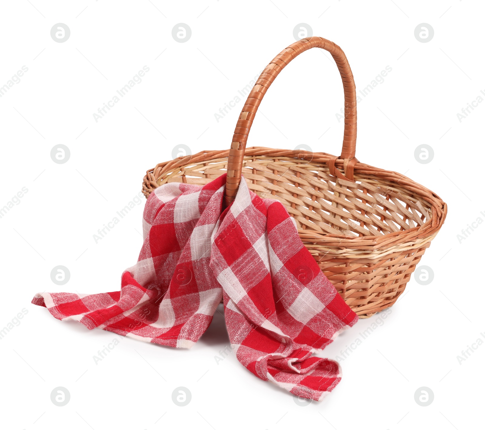 Photo of One picnic wicker basket with checkered napkin isolated on white