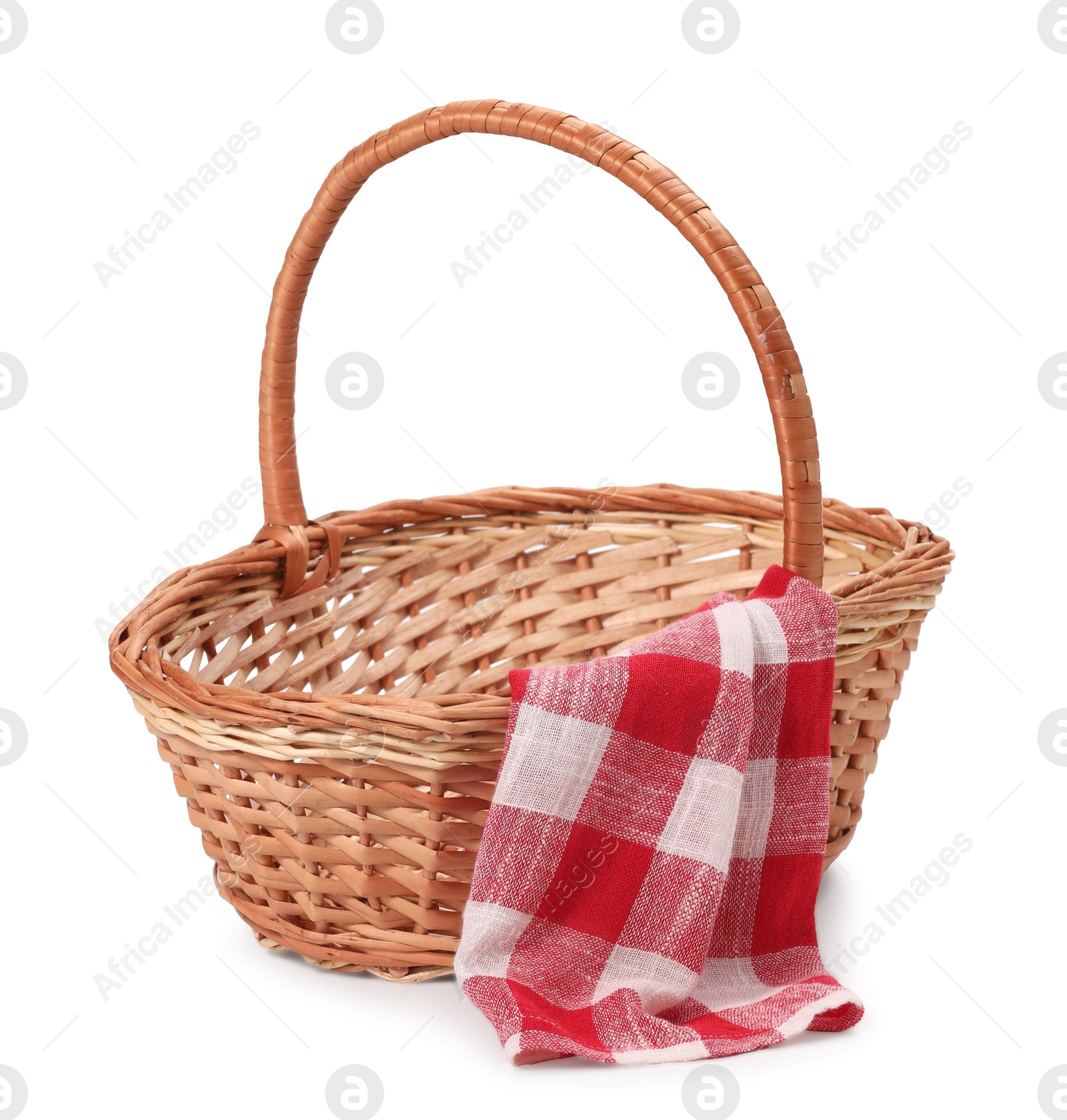 Photo of One picnic wicker basket with checkered napkin isolated on white