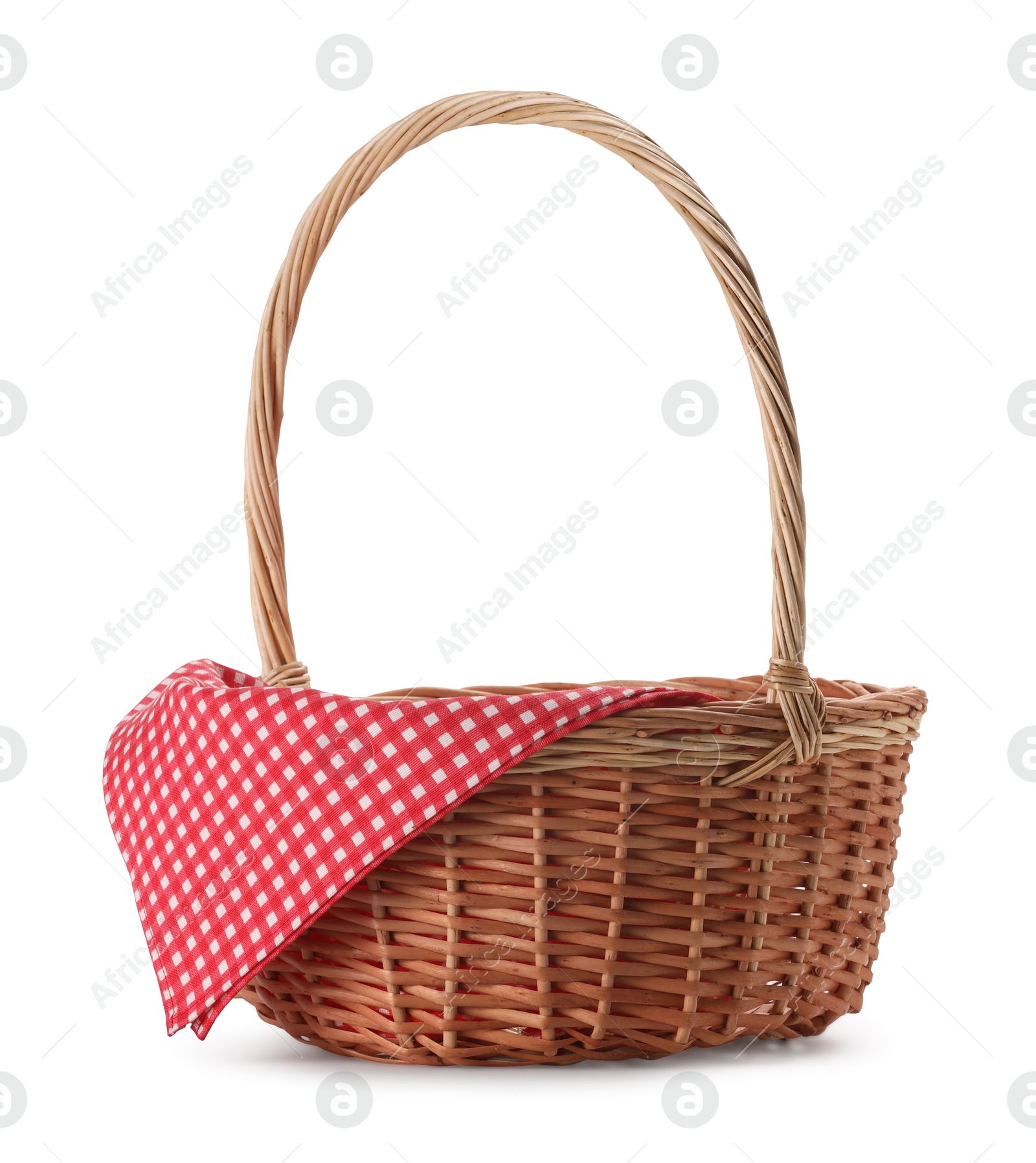 Photo of One picnic wicker basket with checkered napkin isolated on white