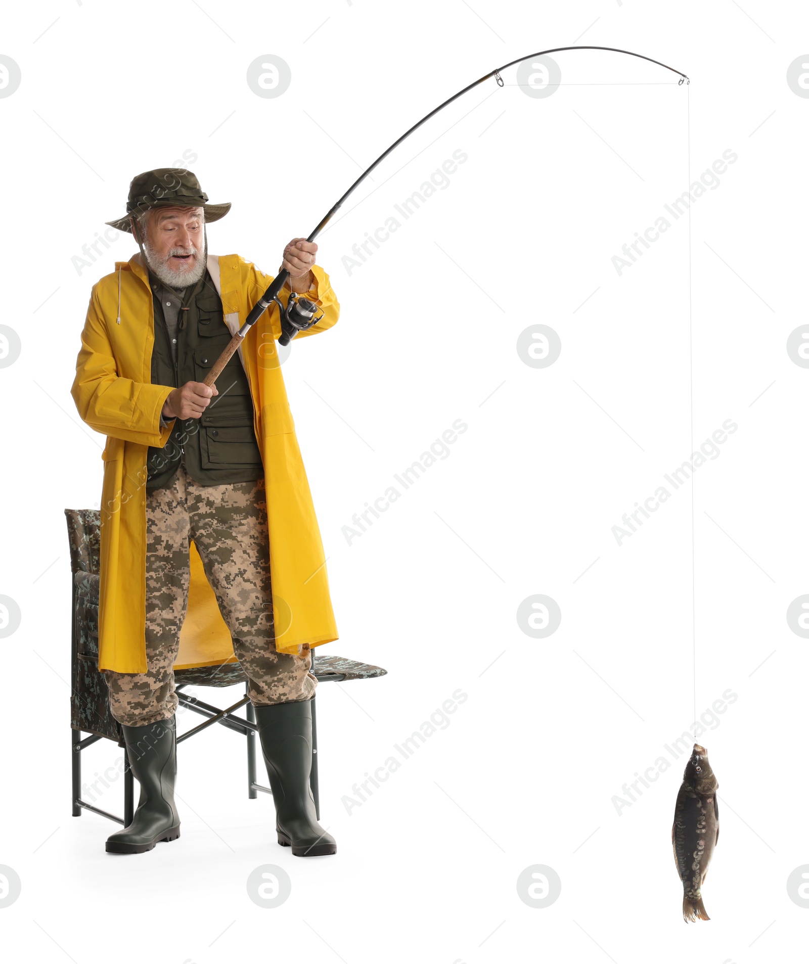 Photo of Fisherman with rod and catch on white background