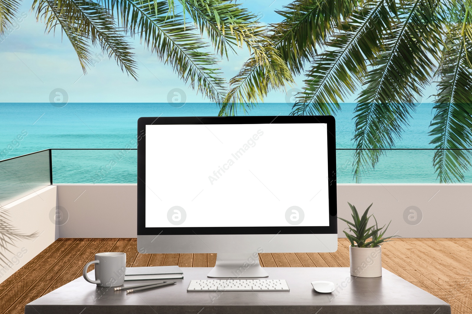 Image of Workplace at beach, distant office. Table with computer on seashore. Mockup for design