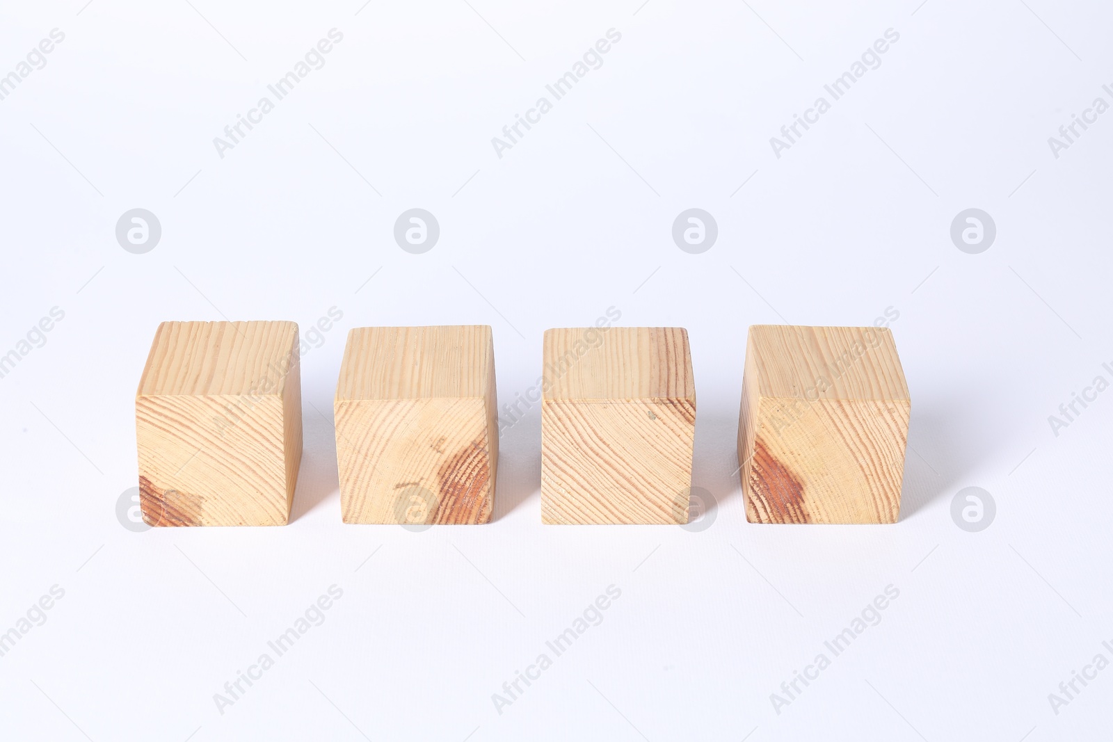 Photo of Many blank wooden cubes on white background