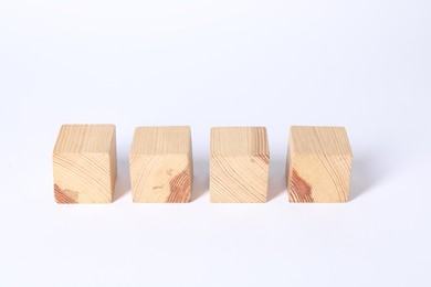 Many blank wooden cubes on white background