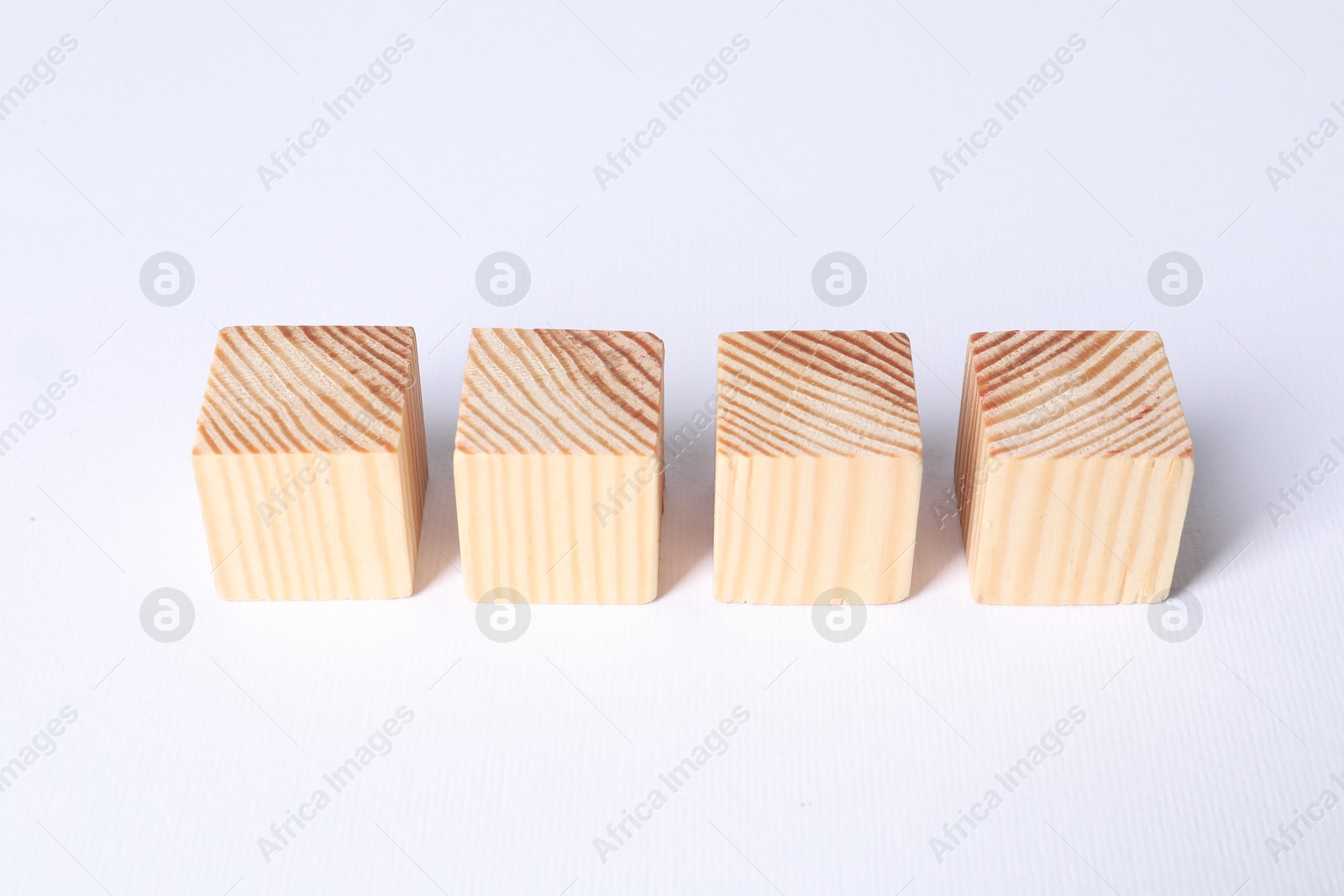 Photo of Many blank wooden cubes on white background