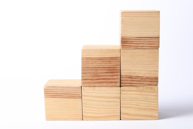 Photo of Many blank wooden cubes on white background