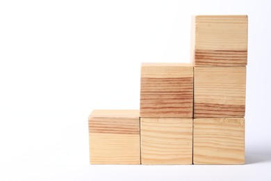 Photo of Many blank wooden cubes on white background