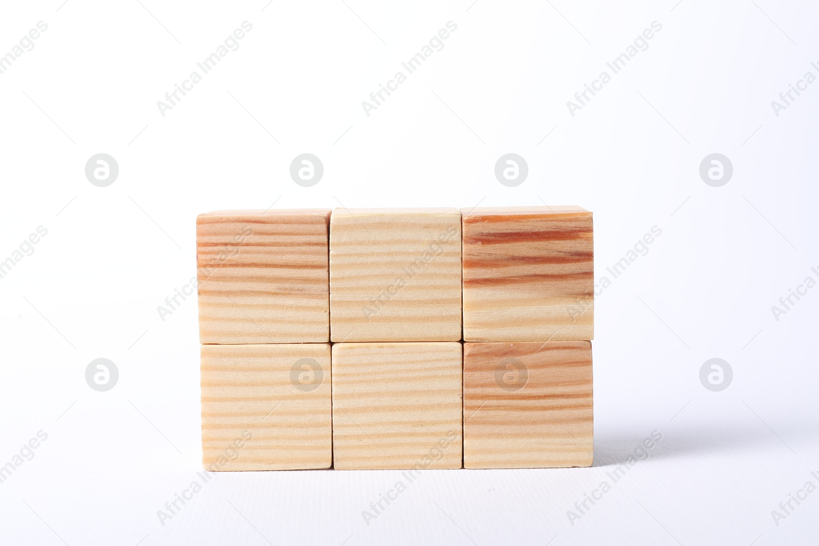 Photo of Many blank wooden cubes on white background