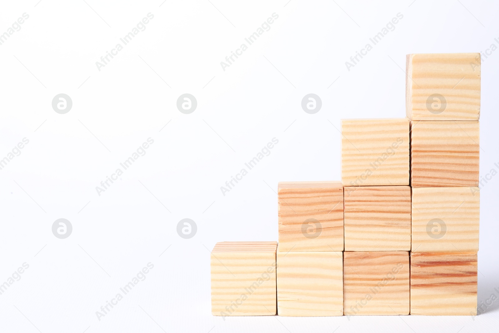 Photo of Many blank wooden cubes on white background, space for text