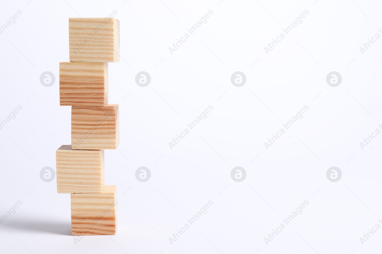 Photo of Many blank wooden cubes on white background, space for text