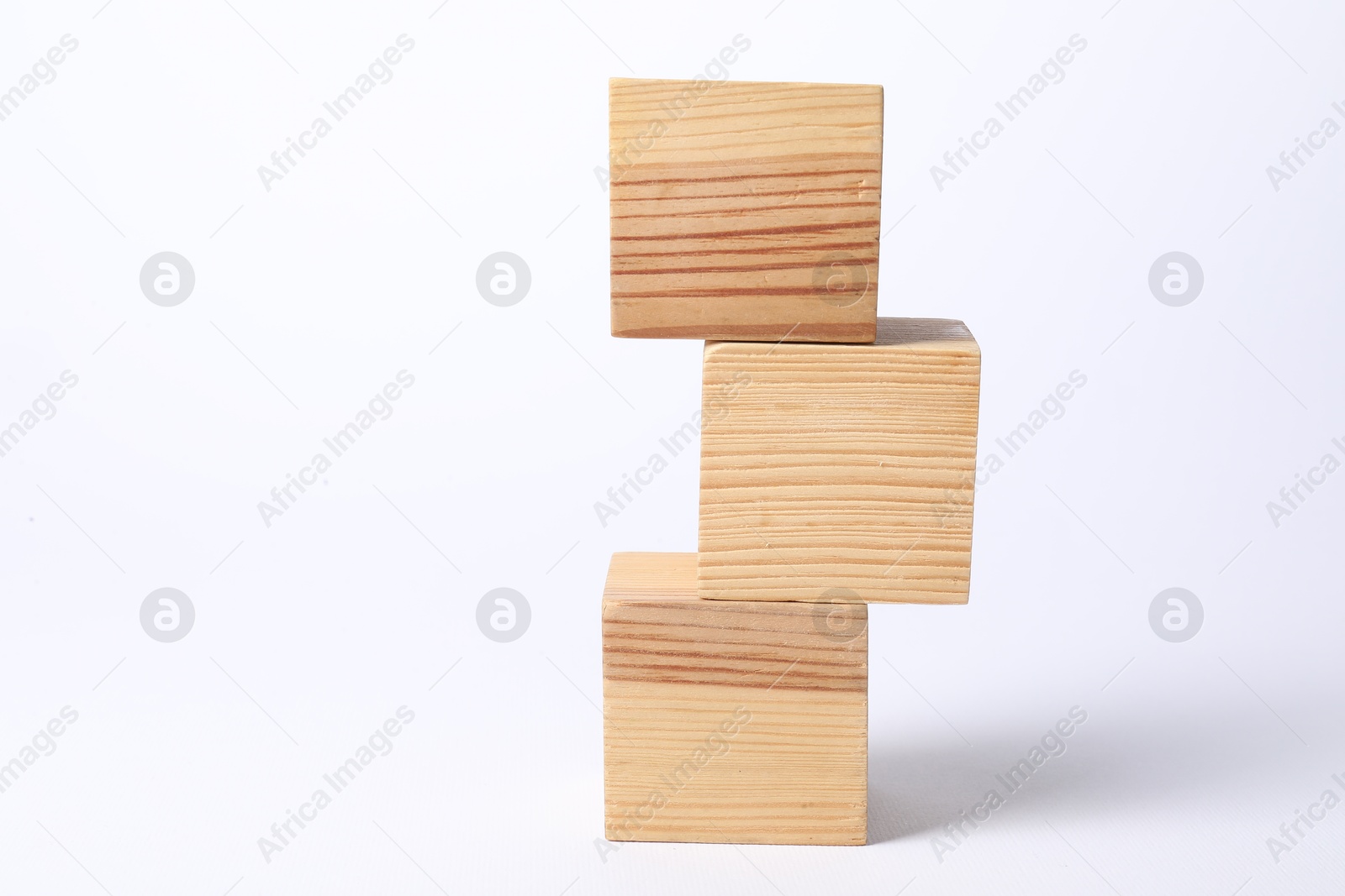 Photo of Three blank wooden cubes on white background, space for text