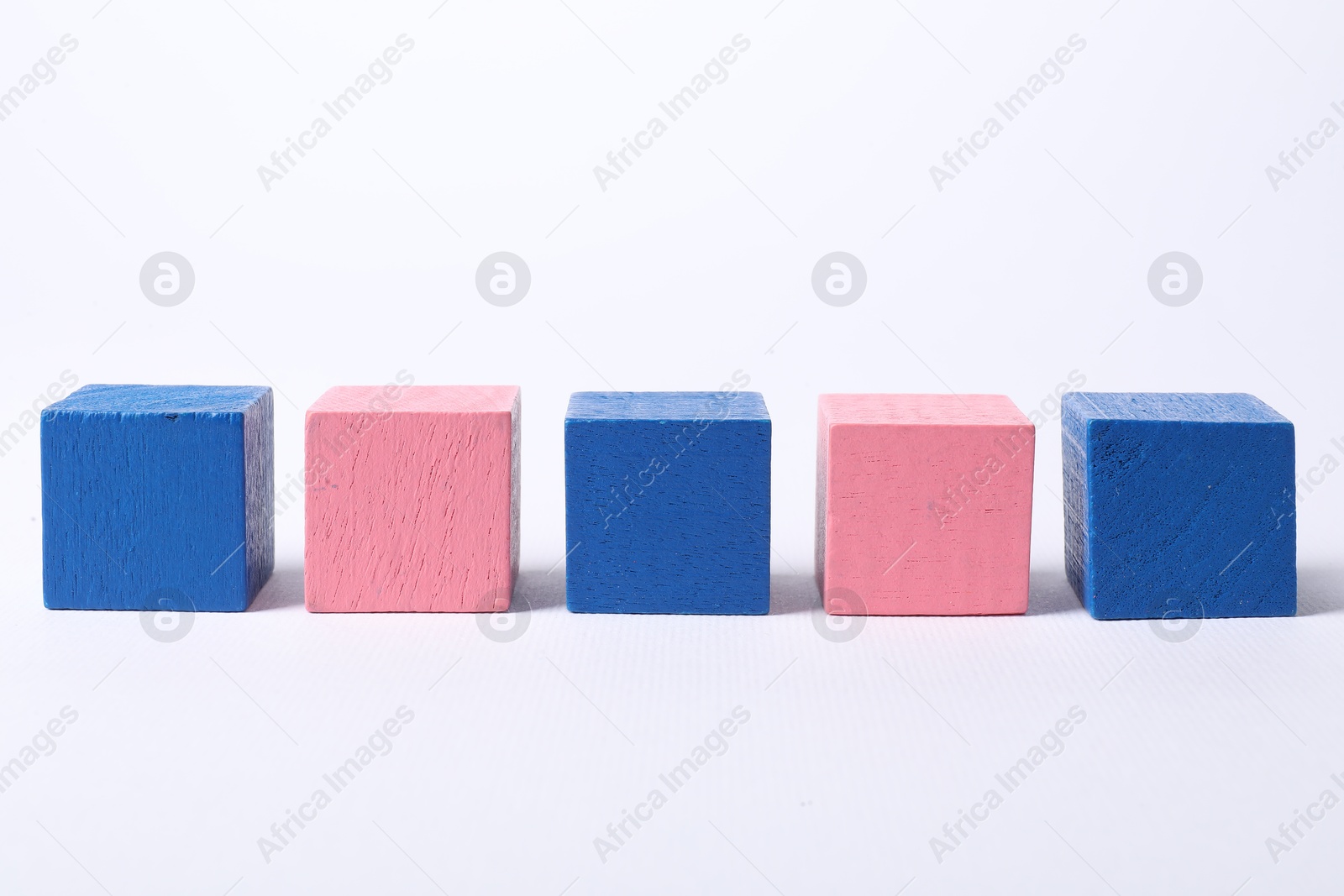 Photo of Many blank colorful cubes on white background