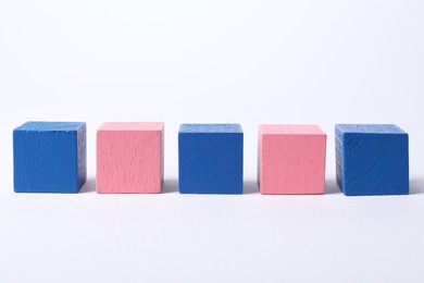 Photo of Many blank colorful cubes on white background