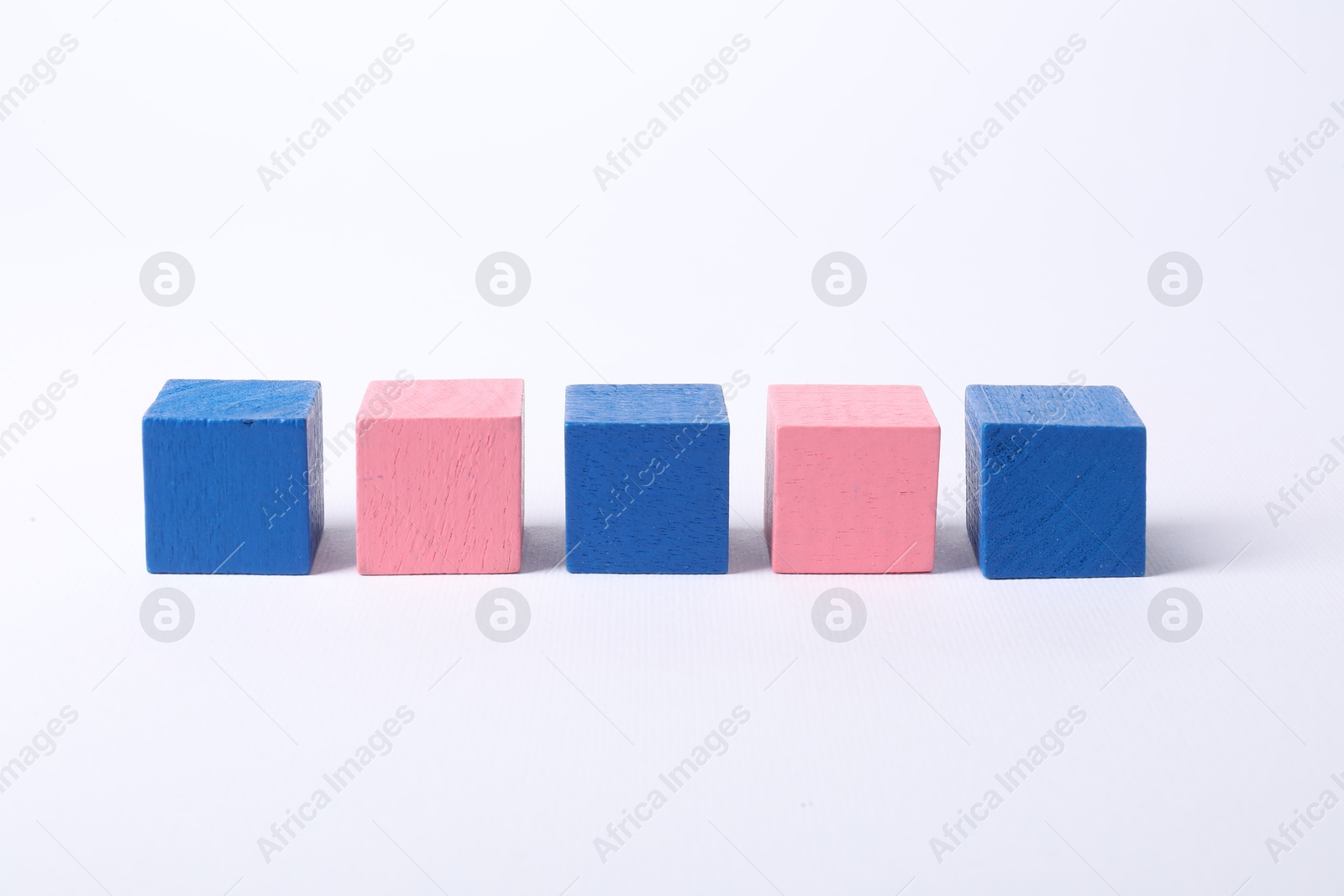 Photo of Many blank colorful cubes on white background