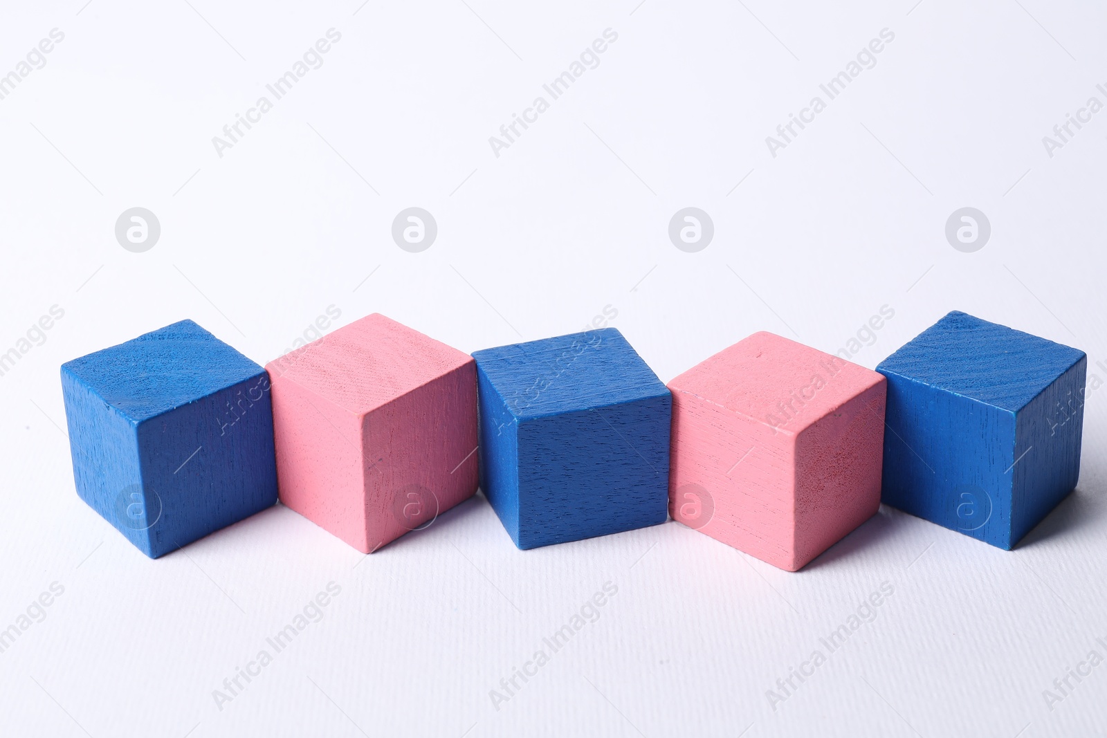 Photo of Many blank colorful cubes on white background