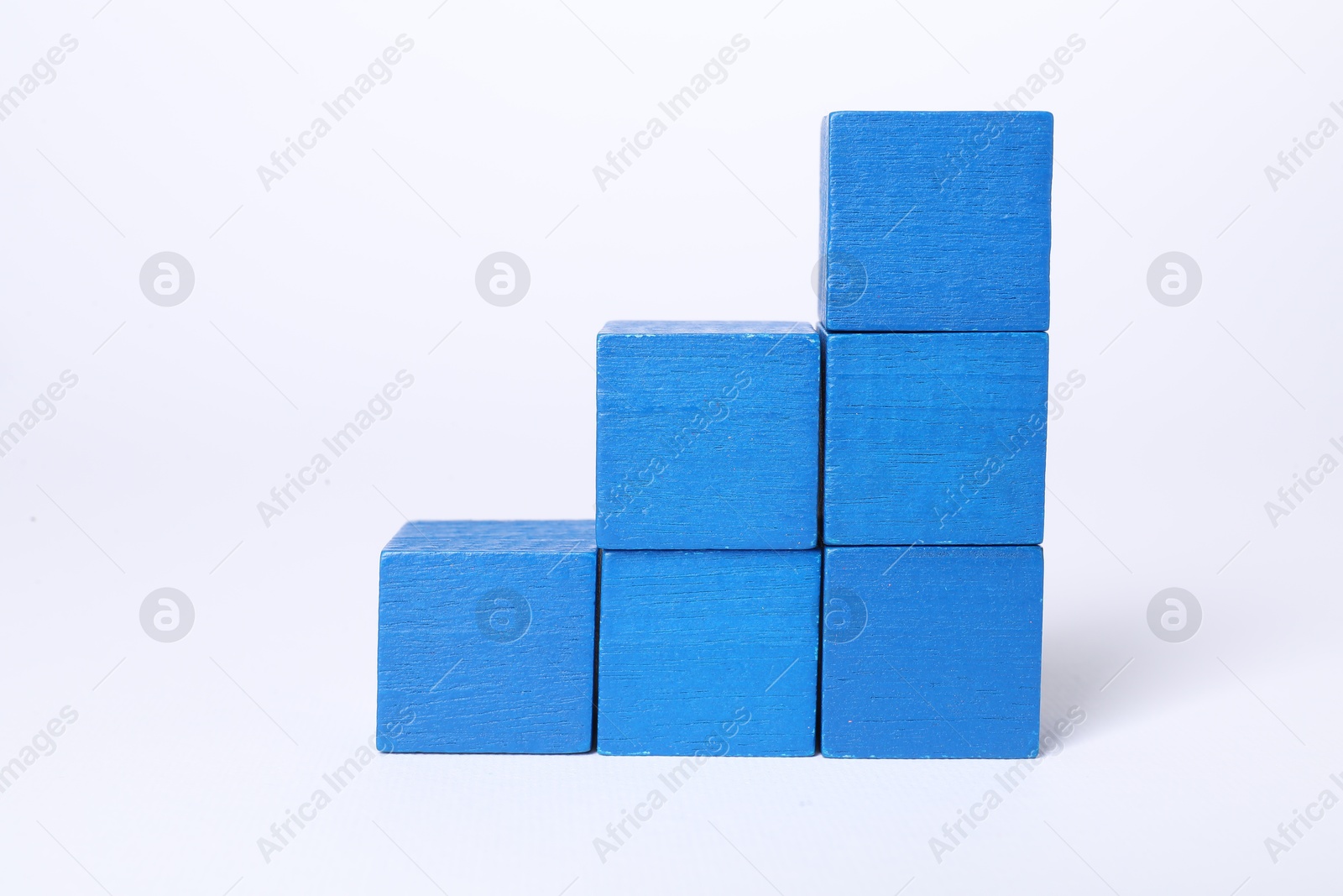 Photo of Many blank colorful cubes on white background