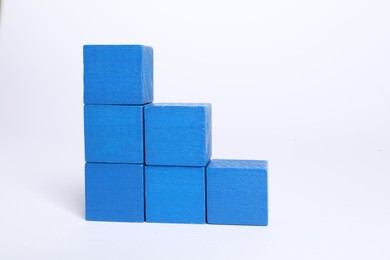 Photo of Many blank colorful cubes on white background