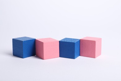 Photo of Many blank colorful cubes on white background