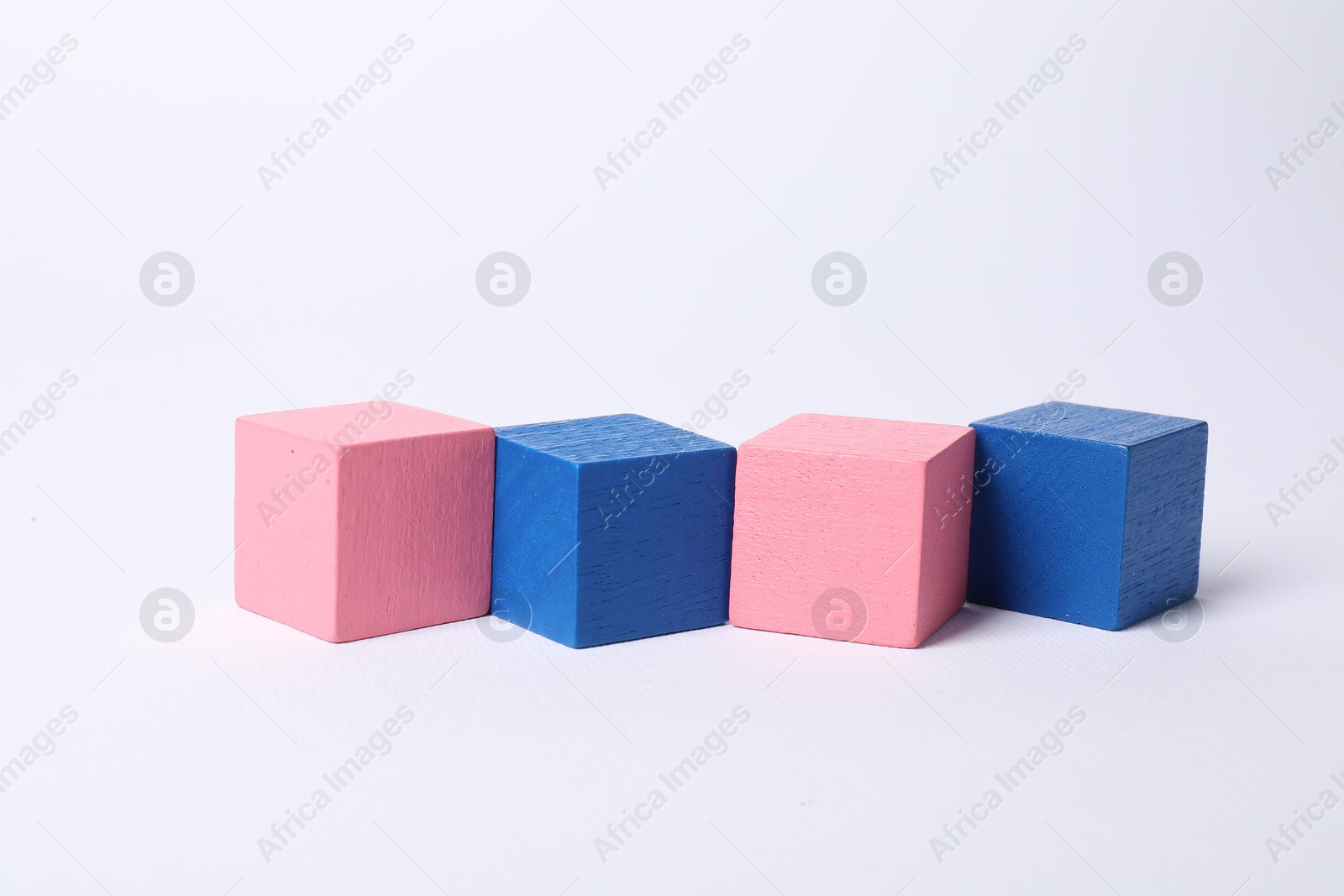 Photo of Many blank colorful cubes on white background