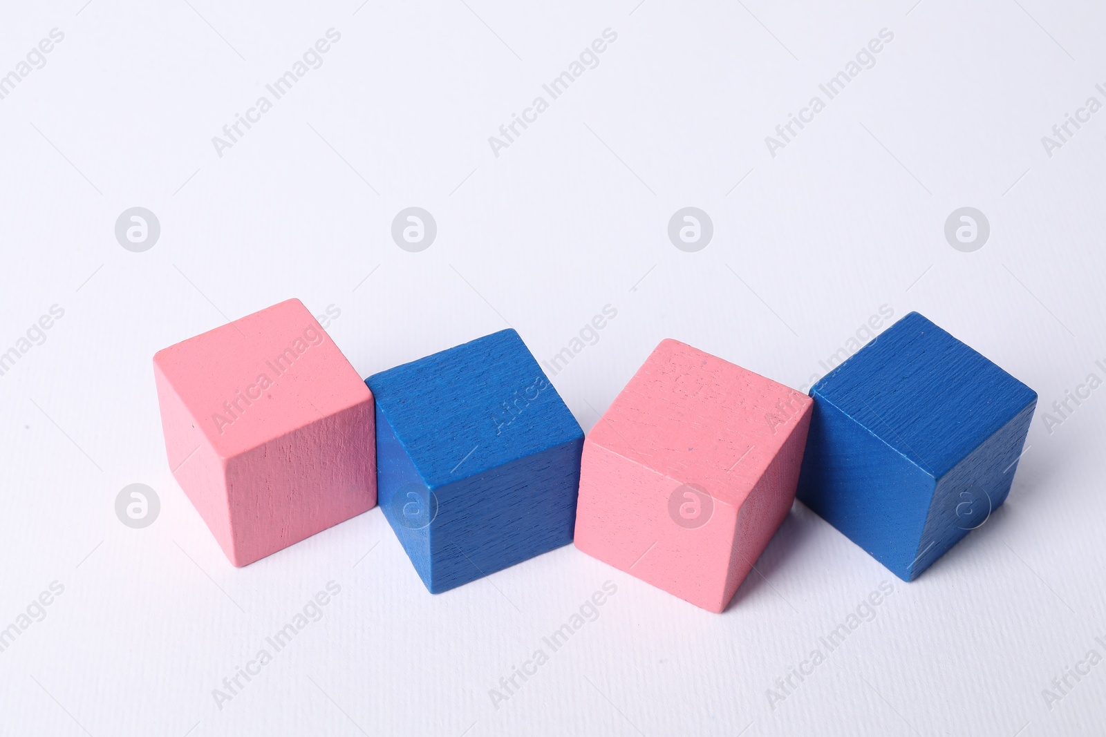 Photo of Many blank colorful cubes on white background