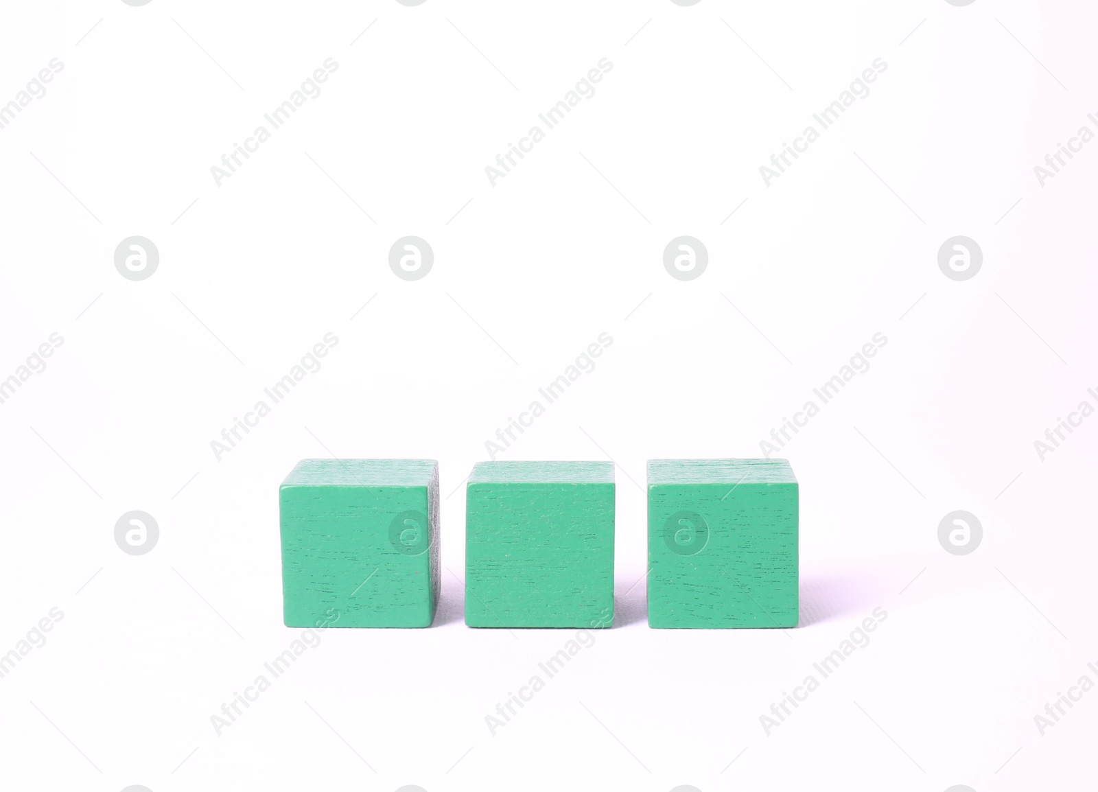 Photo of Three blank green cubes on white background