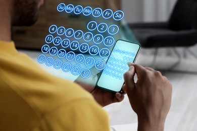 Image of Making timetable. Man using smartphone, closeup. Virtual calendar projected from device