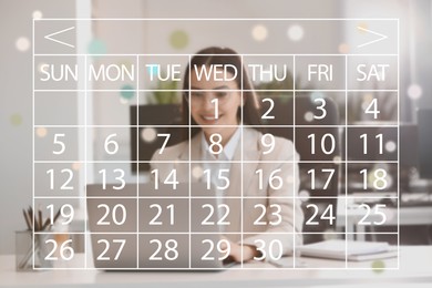 Businesswoman making timetable in laptop at table. Virtual calendar in foreground